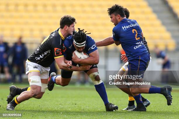 Aki Seiuli of Otago is tackled by Will Mangos of Wellington during the round one Mitre 10 Cup match between Wellington and Otago at Westpac Stadium...