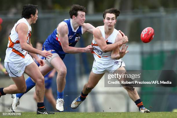 Rhylee West of Calder Cannons handballs during the TAC Cup round 15 match between Eastern Ranges and Calder Cannons at Avalon Airport Oval on August...