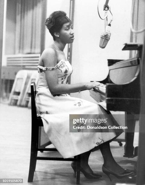 Musician Aretha Franklin recording at the piano at Columbia Studios in 1962 in New York.