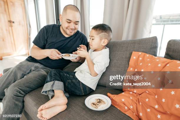 gaining weight on children - filipino family eating stock pictures, royalty-free photos & images