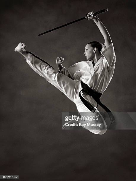 young woman practising martial arts (b&w) - 武道 ストックフォトと画像