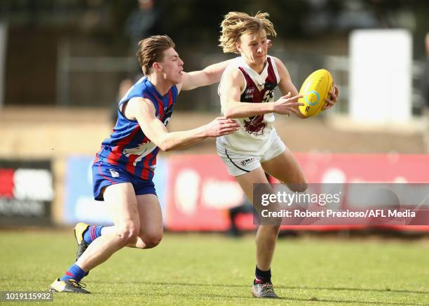 Hugo Ralphsmith of Sandringham Dragons is tackled during the TAC Cup round 15 match between Oakleigh Chargers and Sandringham Dragons at Avalon...