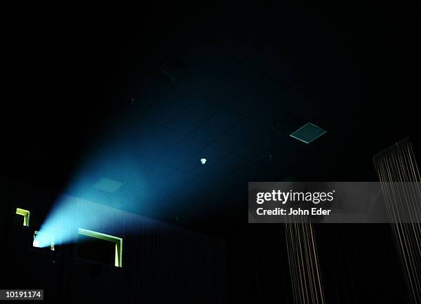 beam of light coming from movie projector - film light stock-fotos und bilder