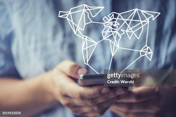 globaly connected thanks to a smartphone - smartphone hologram stock pictures, royalty-free photos & images