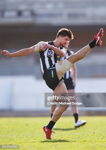 Michael Chippendale of the Magpies kicks the ball during the round 20 VFL match between Collingwood and Frankston at Victoria Park on August 19, 2018...