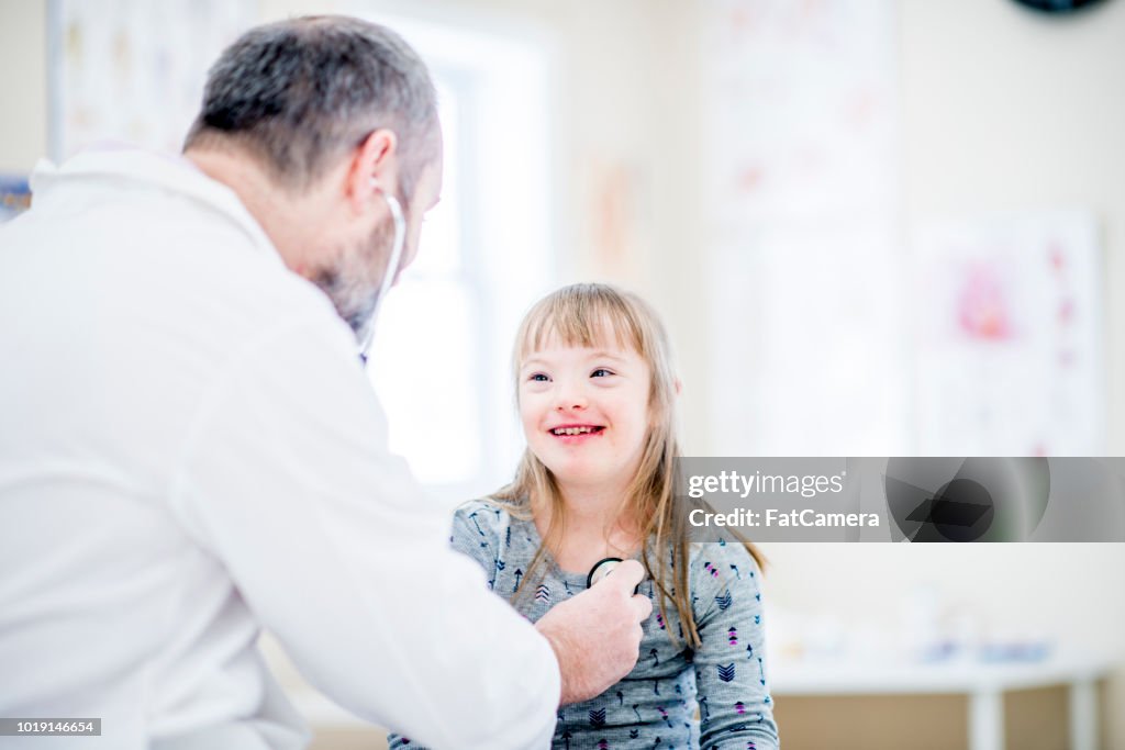 Girl With Down Syndrome Having Checkup