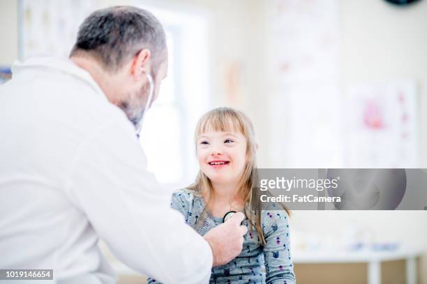 Girl With Down Syndrome Having Checkup