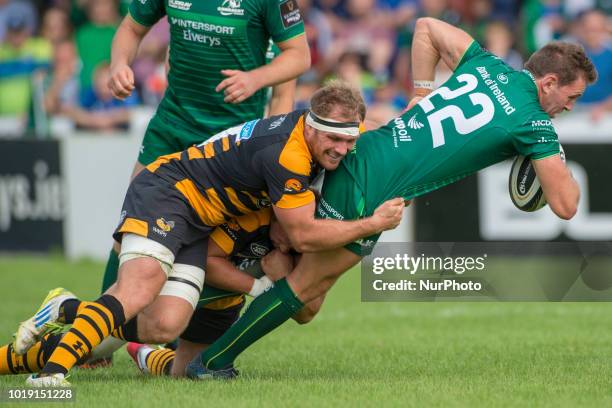 Craig Ronaldson of Connacht tackled by Joe Atkinson of Wasps during the Pre Season friendly match between Connacht Rugby and Wasps at Dubarry Park in...