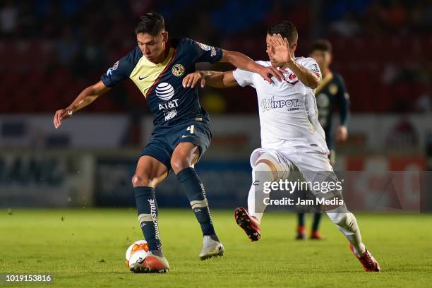 Edson Alvarez of America fights for the ball with Carlos Esquivel of Veracruz during a match between Veracruz and Club America as part of Copa MX...