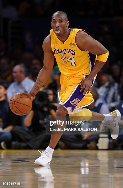 Lakers guard Kobe Bryant dribbles the ball against Boston Celtics before the LA Lakers went on to win 102-89 in game one of the NBA finals at the...