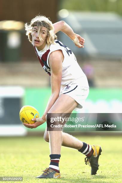 Joshua Worrell of Sandringham Dragons handballs during the TAC Cup round 15 match between Oakleigh Chargers and Sandringham Dragons at Avalon Airport...