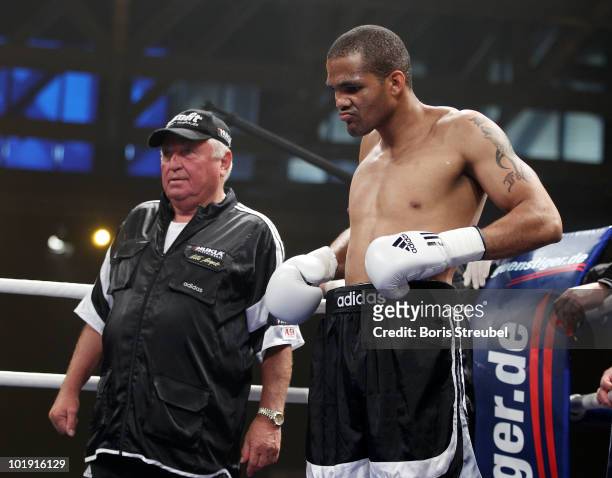 Yoan Pablo Hernandez of Cuba and his coach Ulli Wegner attend the Cruiserweight fight against Zack Page of the U.S. At Jahnsportforum on June 5, 2010...