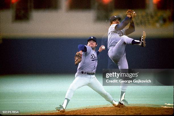 Multiple exposure captures Fernando Valenzuela of the Los Angeles Dodgers pitching during a Major League Baseball game against the Pittsburgh Pirates...
