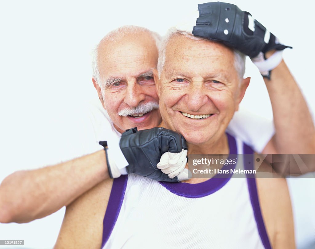 Two mature men smiling, smiling, close-up