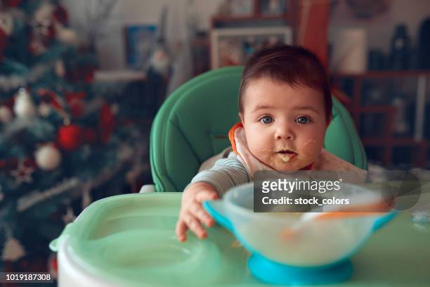 baby girl at lunch time - one baby girl only stock pictures, royalty-free photos & images