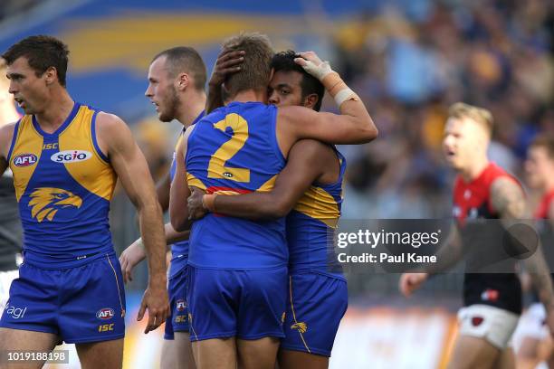 Mark LeCras and Willie Rioli of the Eagles celebrate a goal during the round 22 AFL match between the West Coast Eagles and Melbourne Demons at Optus...