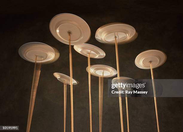 plates spinning on poles, low angle view (blurred motion) - plate set stock pictures, royalty-free photos & images