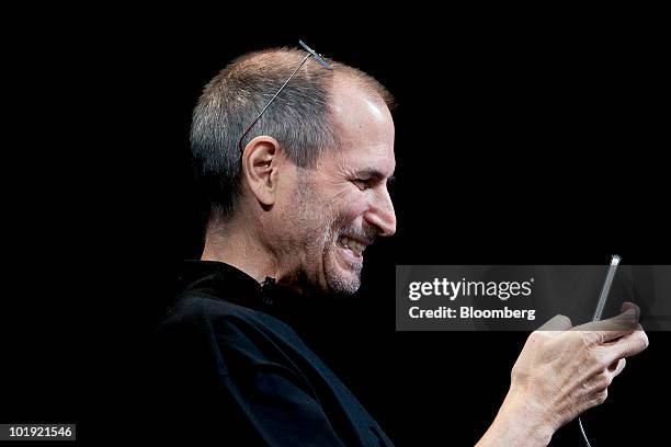 Steve Jobs, chief executive officer of Apple Inc., demonstrates the FaceTime video call functionality of the iPhone 4 during his keynote address at...