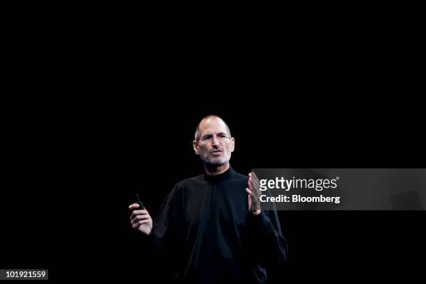 Steve Jobs, chief executive officer of Apple Inc., unveils the iPhone 4 during his keynote address at the Apple Worldwide Developers Conference in...