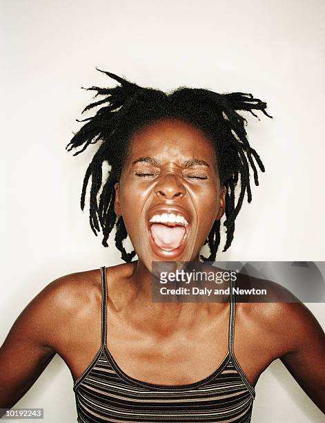 young woman screaming, close-up - screaming stock pictures, royalty-free photos & images