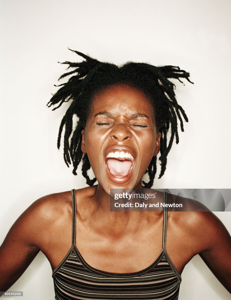 Young woman screaming, close-up