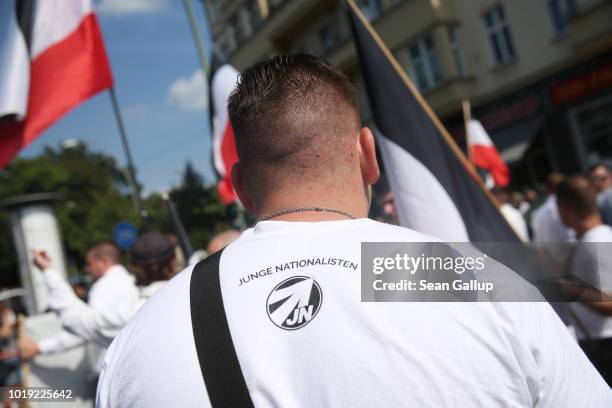 Member of the Junge Nationalisten, the youth wing of the far-right NPD politicial party, attends a gathering of neo-Nazis to commemorate the...