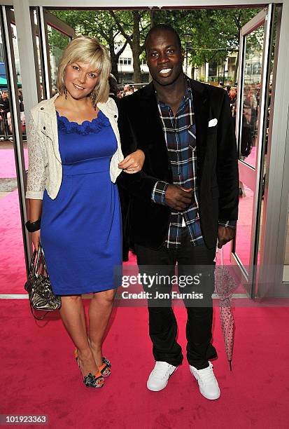 Rugby league player Martin Offiah and Virginia Shaw attend the European Premiere of 'Killers' at Odeon West End on June 9, 2010 in London, England.