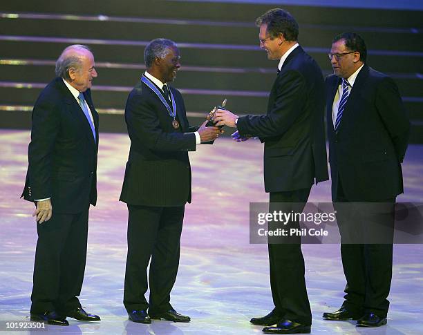 Joseph Blatter President of FIFA and Jerome Valcke Secretary General of FIFA award Thabo Mbeki former President of South Africa with the FIFA order...