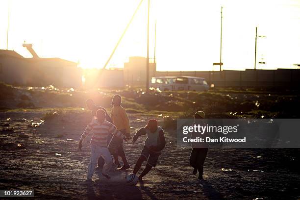 Children play football in the Kayelitsha Township on June 9, 2010 in Cape Town, South Africa. The first World Cup ever held in Africa is due to begin...