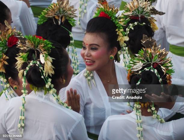 Total of 1800 dancers perform the Rejang Sandat Dance Ratu Segara, in the area of Tanah Lot Temple, Tabanan Regency, Bali, on August 18, 2018. For...