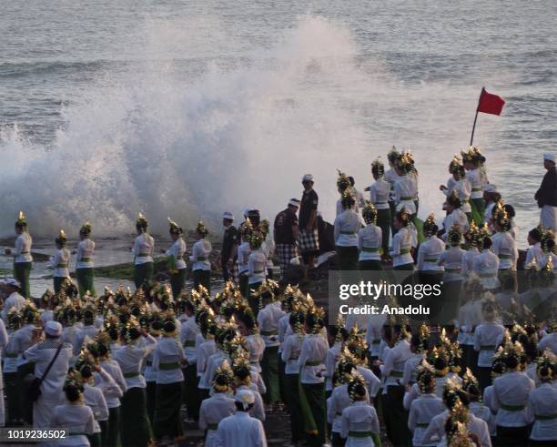 Total of 1800 dancers perform the Rejang Sandat Dance Ratu Segara, in the area of Tanah Lot Temple, Tabanan Regency, Bali, on August 18, 2018. For...