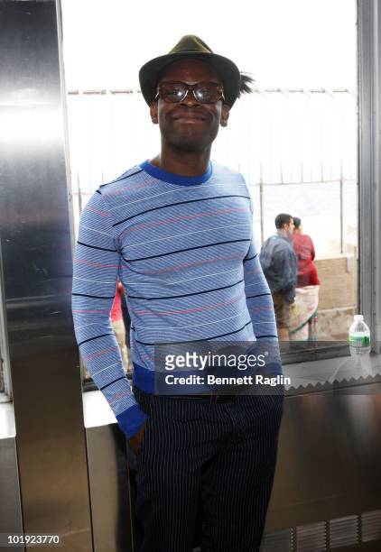 Actor Sahr Ngaujah poses as Tony Award nominees visits The Empire State Building on June 9, 2010 in New York City.