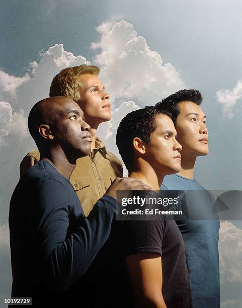 four young men against sky background (digital composite) - hispanic man profile hopeful stock-fotos und bilder