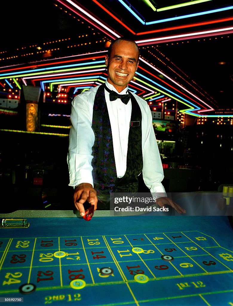 Casino dealer smiling, portrait