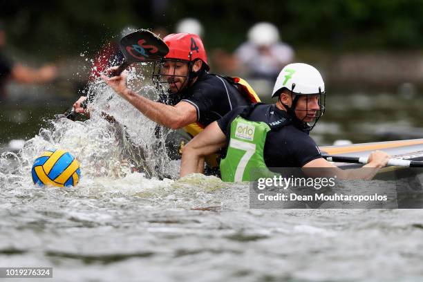 Emmanuel Hirbec of Acigne 1 battles for the ball with Cas van Engelen of Rijnland A during the GEKKO International Canoe Kayak Polo Tournament match...