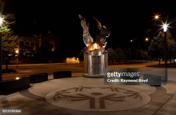 Richard Hunt's The 'Eternal Flame Of Hope', which symbolizes the Special Olympics' theme of inclusion and unity as well as hope, stands outside...