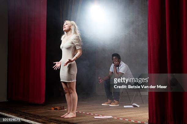 woman rehearsing on stage. - schauspieler stock-fotos und bilder