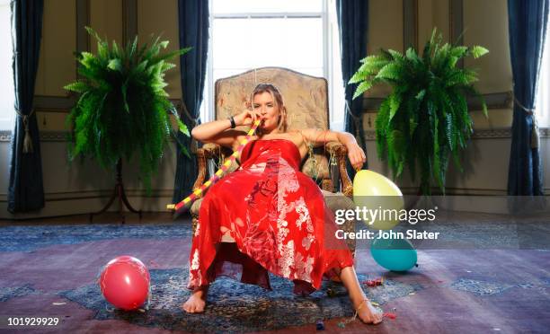 girl slumped in chair with party gimicks - party favor foto e immagini stock