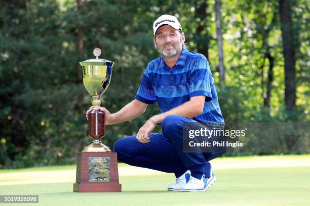 David Shacklady of England poses with the trophy after the final round of the VTB Russian Open Golf Championship played at Moscow Country Club on...