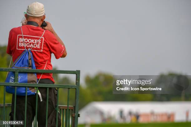 Brooke M. Henderson fan looks through binoculars toward the 15th tee during round 3 play of the Indy Women in Tech Championship on August 18, 2018 at...