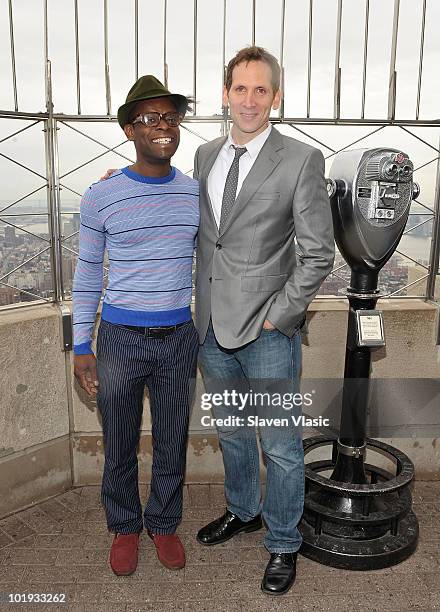 Tony Awards nominees Sahr Ngaujah and Stephen Kunken visit The Empire State Building on June 9, 2010 in New York City.