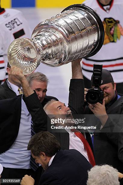 Head coach Joel Quenneville of the Chicago Blackhawks hoists the Stanley Cup after the Blackhawks defeated the Philadelphia Flyers 4-3 in overtime...