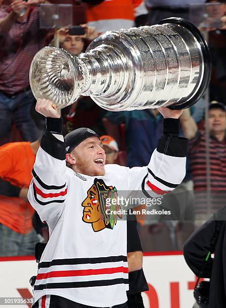 Patrick Kane of the Chicago Blackhawks celebrates with the Stanley Cup after defeating the Philadelphia Flyers 4-3 in overtime in Game Six of the...