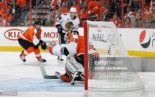 Patrick Kane of the Chicago Blackhawks watches his game winning goal go past Michael Leighton of the Philadelphia Flyers in Game Six of the 2010 NHL...