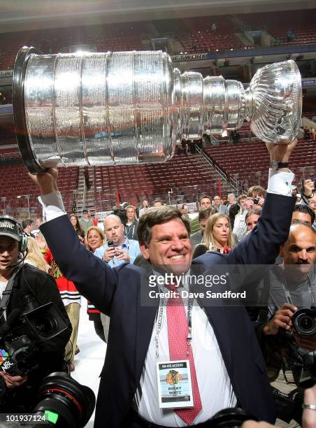 Owner of the Chicago Blackhawks Rocky Wirtz hoists the Stanley Cup after the Blackhawks defeated the Philadelphia Flyers 4-3 in overtime and win the...