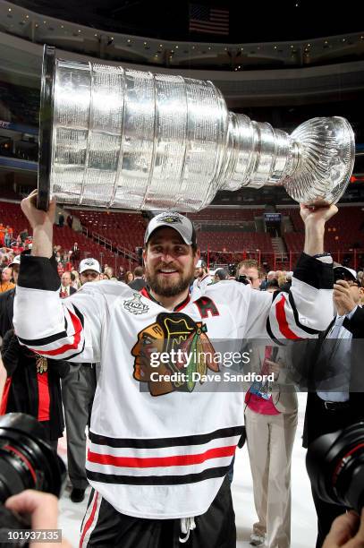 Patrick Sharp of the Chicago Blackhawks celebrates with the Stanley Cup after the Blackhawks defeated the Philadelphia Flyers 4-3 in overtime and win...