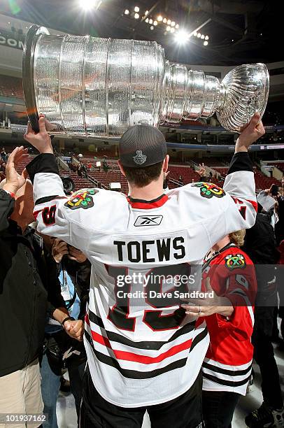 Jonathan Toews of the Chicago Blackhawks celebrates with the Stanley Cup after the Blackhawks defeated the Philadelphia Flyers 4-3 in overtime and...