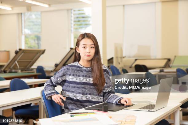 a young asian girl student in the classroom - auckland university stock pictures, royalty-free photos & images