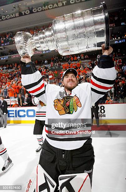 Goaltender Cristobal Huet of the Chicago Blackhawks celebrates with the Stanley Cup after the Blackhawks defeated the Philadelphia Flyers 4-3 in...