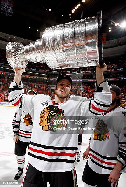 Niklas Hjalmarsson of the Chicago Blackhawks celebrates with the Stanley Cup after the Blackhawks defeated the Philadelphia Flyers 4-3 in overtime...